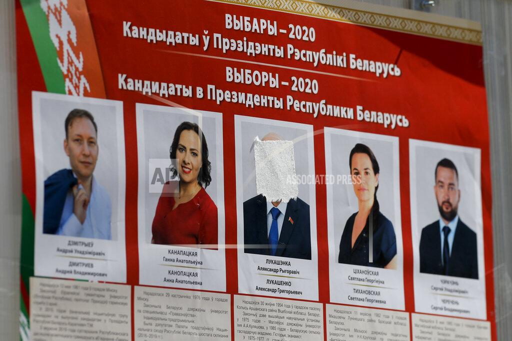 Sergei Grits A billboard on the street with portraits of presidential candidates with the Belarus President Alexander Lukashenko's face covered with a white sticky tape ahead of Sunday's election in Minsk, Belarus, Tuesday, Aug. 4, 2020. Belarus's authoritarian leader is vowing to maintain a close alliance with Russia despite the latest tensions as he seeks a sixth term in office amid a surge of opposition protests. President Alexander Lukashenko's comments in a state-of-the-nation address ahead of Sunday's election contrast with his diatribes against Russia last week. (AP Photo/Sergei Grits)