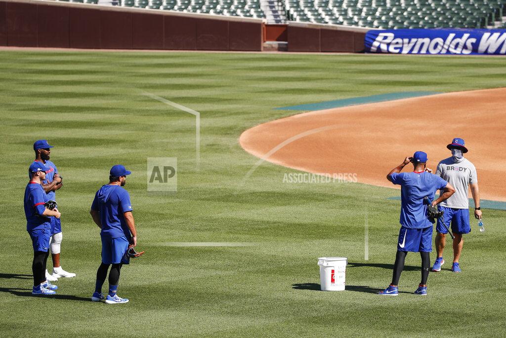 Kamil Krzaczynski Chicago Cubs manager David Ross, right, talks to his players during baseball practice at Wrigley Field on Friday, July 3, 2020 in Chicago. (AP Photo/Kamil Krzaczynski)