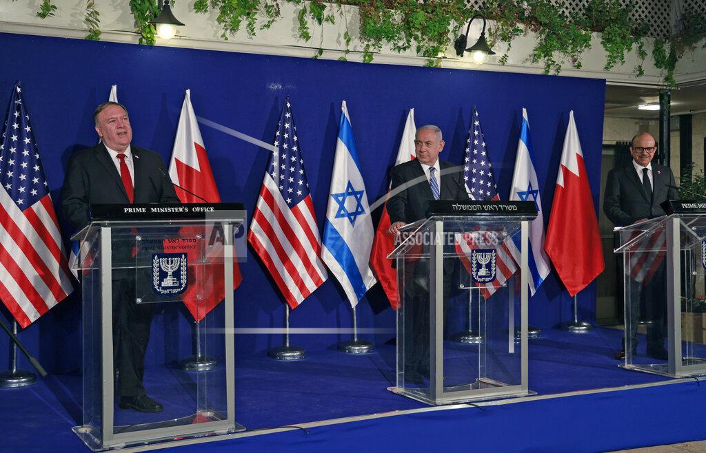 Menahem Kahana Israeli Prime Minister Benjamin Netanyahu, center, and Bahrain's Foreign Minister Abdullatif bin Rashid Alzayani, right, listen as U.S. Secretary of State Mike Pompeo speaks during a joint press conference after their trilateral meeting in Jerusalem on Wednesday, Nov. 18, 2020. (Menahem Kahana/Pool via AP)