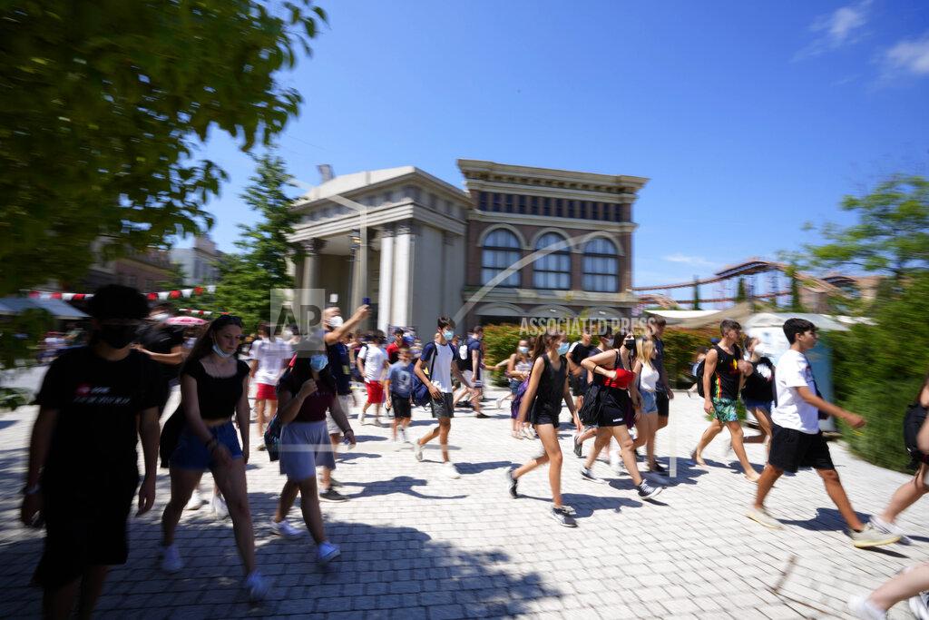 Alessandra Tarantino People arrive at Cinecitta World amusement park in the outskirts of Rome in the day of its reopening, Thursday, June 17, 2021. Amusement parks have been closed since Oct. 25 2020, when Italy's second national lockdown started. (AP Photo/Alessandra Tarantino)