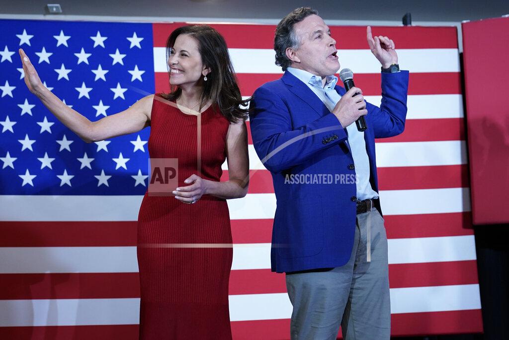 Keith Srakocic Republican candidate for a Pennsylvania U.S. Senate seat, Dave McCormick, right, and his wife Dinah Powell, talk to supporters as returns show a close race during his returns watch party in the Pennsylvania primary election, Tuesday, May 17, 2022, in Pittsburgh. (AP Photo/Keith Srakocic)