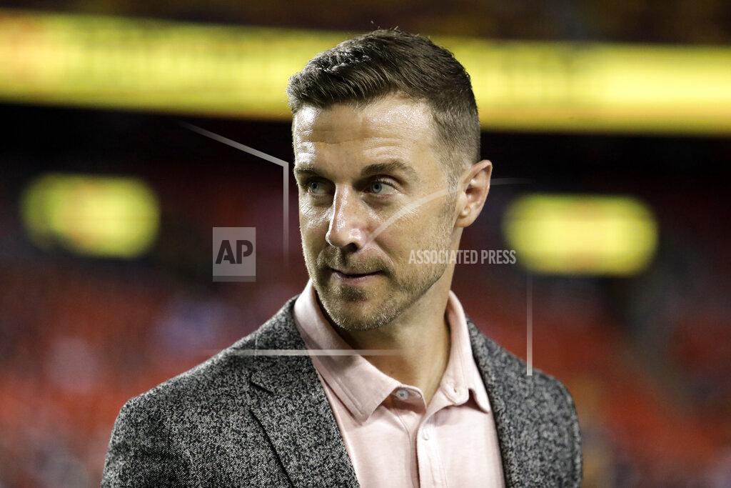 Julio Cortez FILE - In this Sept. 23, 2019, file photo, Washington Redskins quarterback Alex Smith stands on the field before an NFL football game against the Chicago Bears in Landover, Md. Quarterback Alex Smith was activated Sunday, Aug. 16, 2020 off the physically unable to perform list by Washington’s NFL team, the latest step in his remarkable recovery after his right leg was broken in two places during a game nearly two years ago. (AP Photo/Julio Cortez, File)