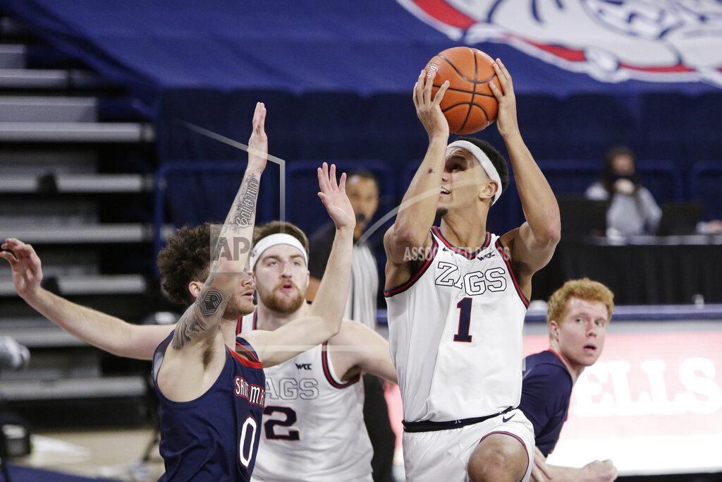 Young Kwak Gonzaga guard Jalen Suggs (1) shoots over Saint Mary's guard Logan Johnson (0) during the second half of an NCAA college basketball game in Spokane, Wash., Thursday, Feb. 18, 2021. (AP Photo/Young Kwak)