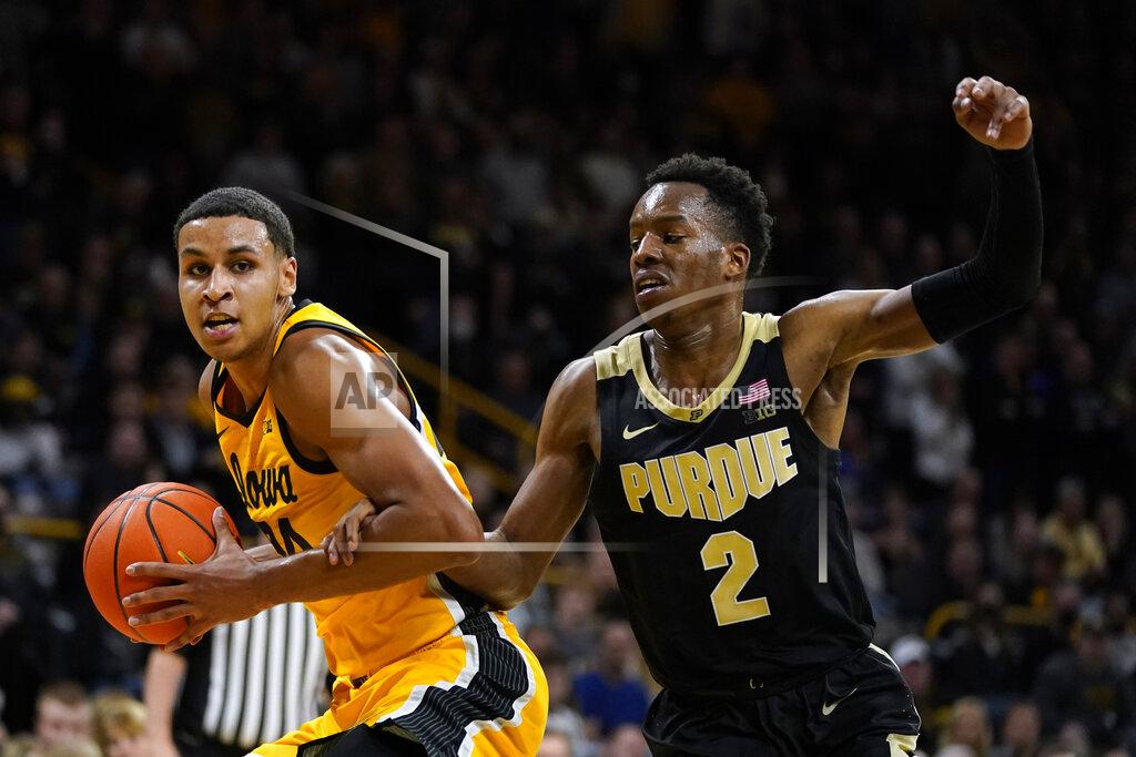 Charlie Neibergall Iowa forward Kris Murray drives past Purdue guard Eric Hunter Jr. (2) during the second half of an NCAA college basketball game, Thursday, Jan. 27, 2022, in Iowa City, Iowa. (AP Photo/Charlie Neibergall)