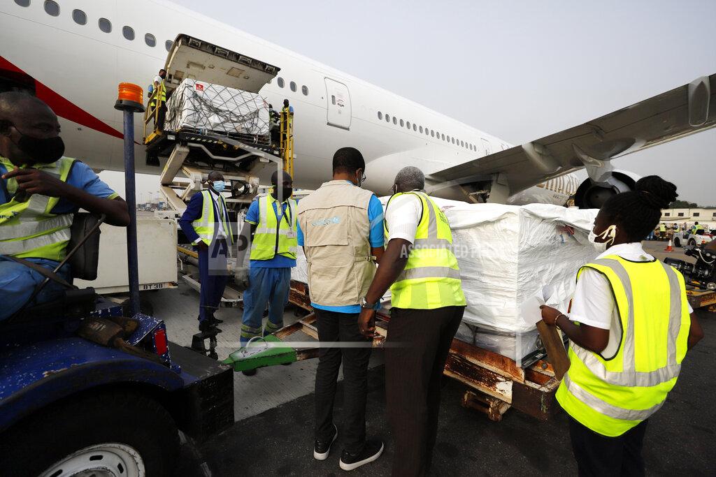 This photograph released by UNICEF Wednesday Feb. 24, 2021 shows the first shipment of COVID-19 vaccines distributed by the COVAX Facility arriving at the Kotoka International Airport in Accra, Ghana. As the coronavirus pandemic exploded worldwide last April, global organizations banded together to help ensure vaccines would be distributed fairly. But the COVAX initiative has been dogged by shortages of cash and supplies as well as logistical hurdles, and only on Wednesday did the first vaccines bought by program arrive in Ghana. (Francis Kokoroko/UNICEF via AP)