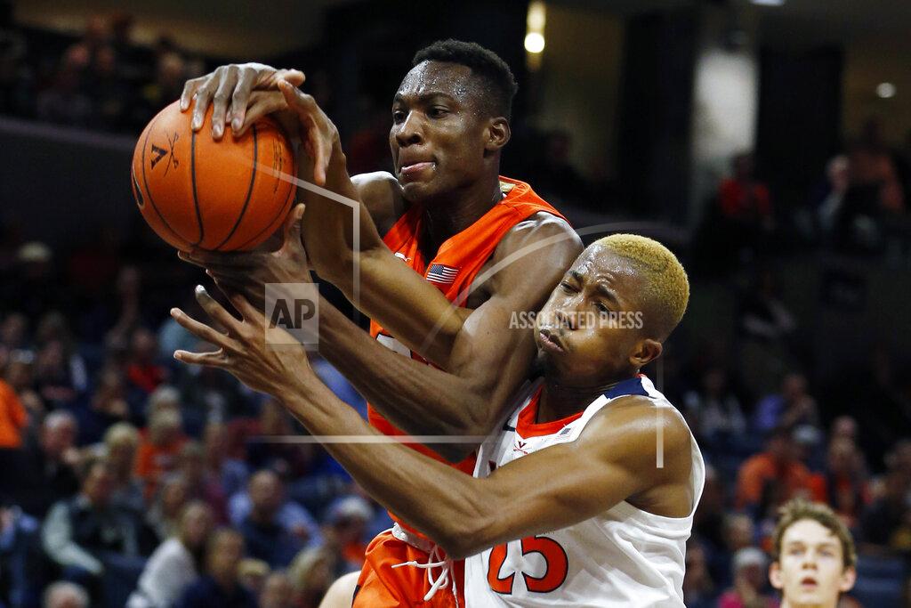 Steve Helber Syracuse forward Bourama Sidibe (34) and Virginia forward Mamadi Diakite (25) battle for a rebound during the first half of an NCAA college basketball game in Charlottesville, Va., Saturday, Jan. 11, 2020. (AP Photo/Steve Helber)