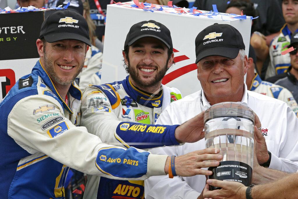 Wesley Broome Chase Elliott, center, car owner Rick Hendrick, right, and crew chief Alan Gustafson celebrate in victory lane after Elliot won the NASCAR Cup Series auto race at Charlotte Motor Speedway in Concord, N.C., Sunday, Sept. 29, 2019. (AP Photo/Wesley Broome)
