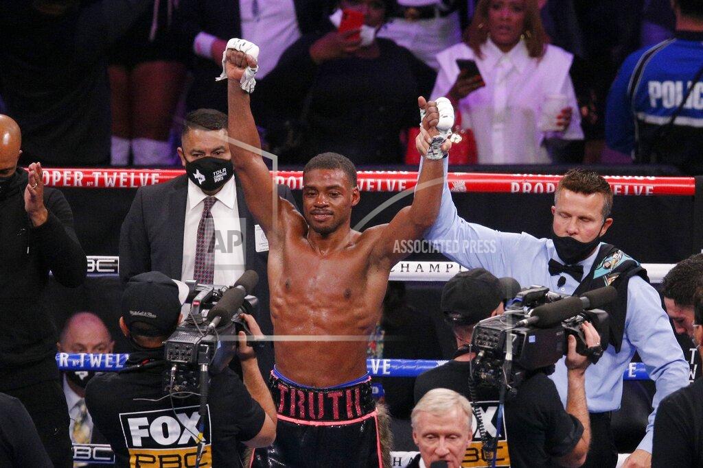 Brandon Wade Errol Spence Jr. celebrates after defeating Danny Garcia by unanimous decision in the WBC-IBF welterweight boxing bout in Arlington, Texas, Saturday, Dec. 5, 2020. (AP Photo/Brandon Wade)