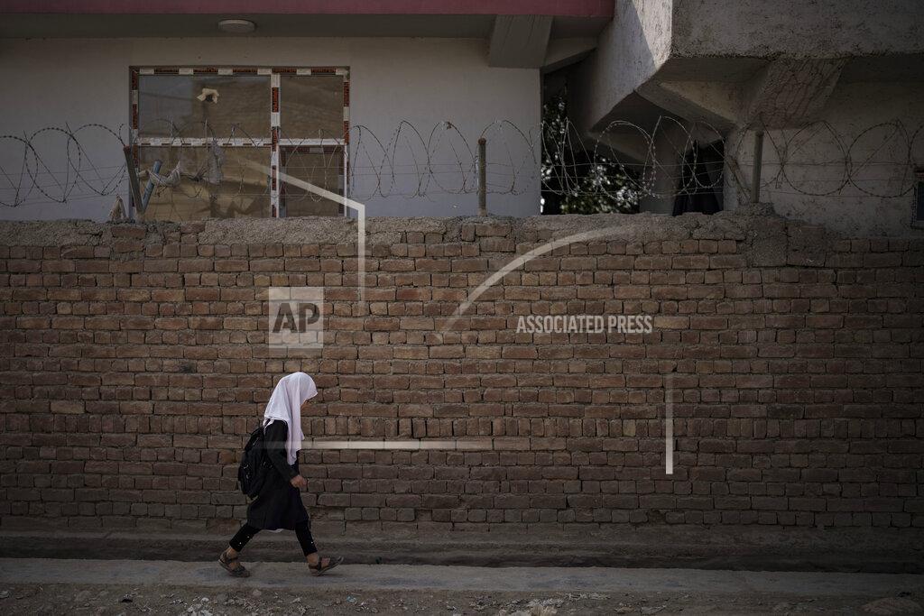 Felipe Dana A girl walks to school before class in Kabul, Afghanistan, Sunday, Sept. 12, 2021. (AP Photo/Felipe Dana)
