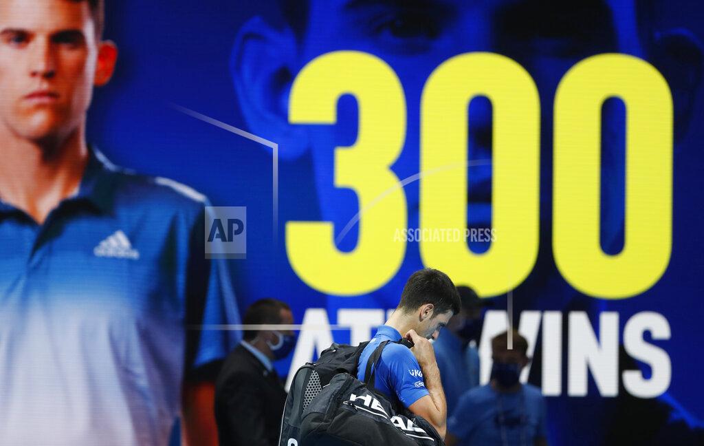 Frank Augstein Novak Djokovic of Serbia leaves after losing his semifinal match against Dominic Thiem of Austria at the ATP World Finals tennis tournament at the O2 arena in London, Saturday, Nov. 21, 2020. (AP Photo/Frank Augstein)