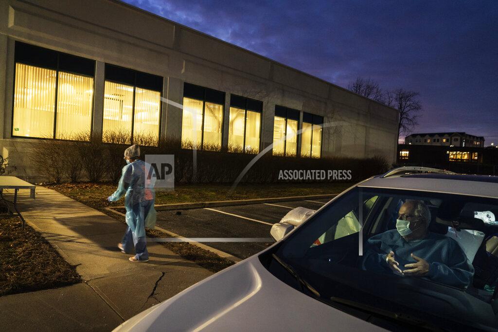 David Goldman COVID-19 patient Nicholas DiPompo, 78, sits in the passenger seat of his niece's car after being discharged from a field hospital where he spent three weeks recovering as registered nurse Subrina Geer returns to her other patients in Cranston, R.I, Wednesday, Jan. 6, 2021. Geer, a 33-year-old nurse working here on a temporary assignment, saw the disease ravage New York City hospitals last year. This is different: "It was a breath of fresh air to see how many patients we could discharge," she said. "It's a thrill in a way compared to what I saw in New York." (AP Photo/David Goldman)