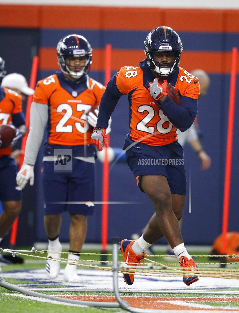 Denver Broncos running back Royce Freeman takes part in drills during the NFL football team's veterans minicamp Tuesday, April 16, 2019, in Englewood, Colo. (AP Photo/David Zalubowski)