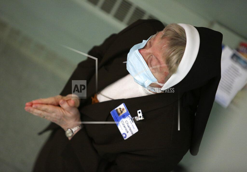 Jessie Wardarski Sister Mary Charlene Ozanick, of the Felician Sisters of North America, prays during morning Mass at St. Anne Home in Greensburg, Pa., on Thursday, March 25, 2021. Communities of Catholic nuns are absorbing devastating losses from outbreaks of the coronavirus. The Felician Sisters lost 21 of their own, in four U.S. convents, a remarkable blow for a community of about 450 women. (AP Photo/Jessie Wardarski)
