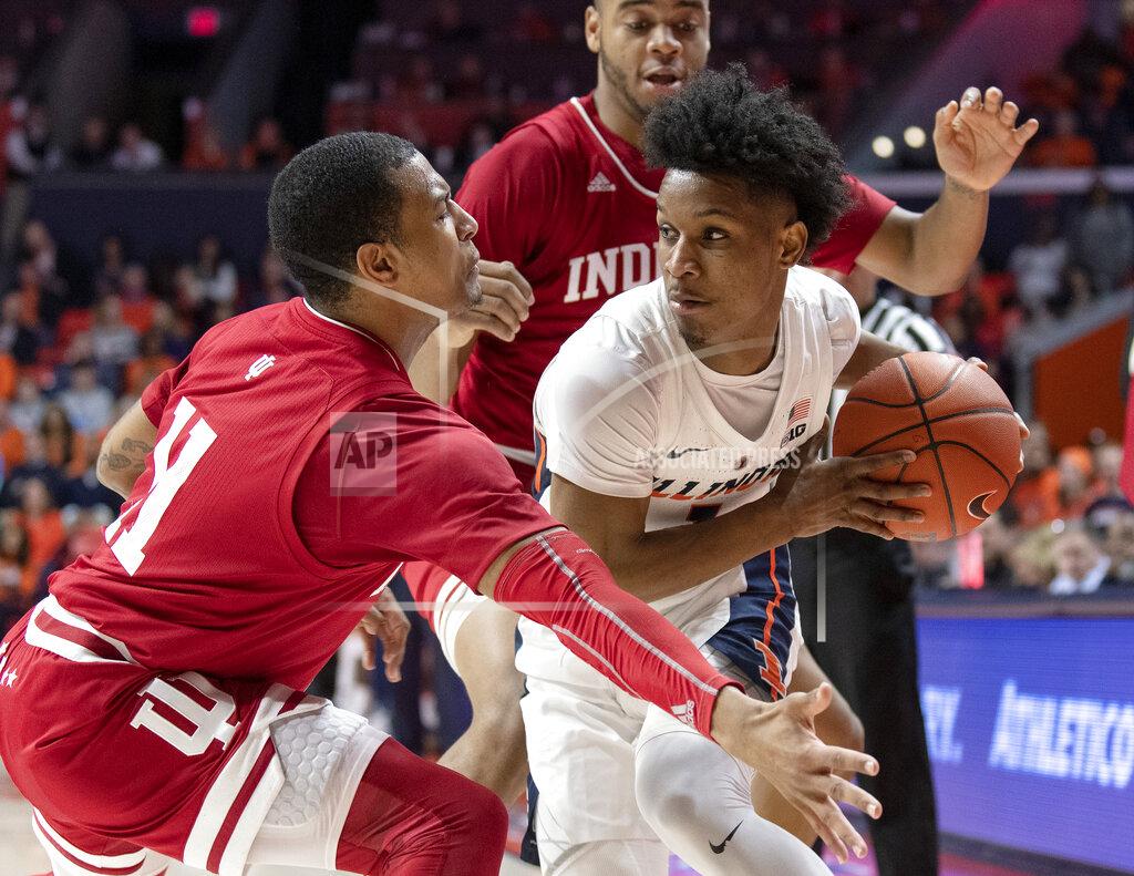 Stephen Haas Illinois guard Trent Frazier (1) looks for room to pass under pressure from Indiana guard Devonte Green (11) and forward Juwan Morgan during the first half of an NCAA college basketball game in Champaign, Ill., Thursday, March 7, 2019. (AP Photo/Stephen Haas)
