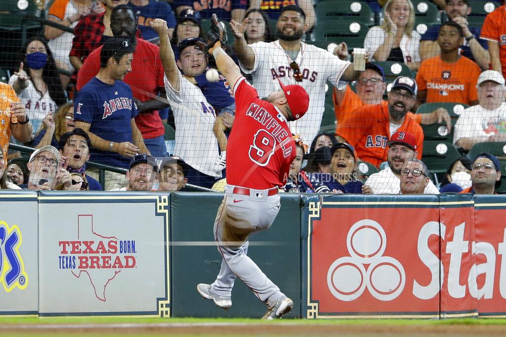 Michael Wyke Los Angeles Angels third baseman Jack Mayfield (9) misses a catch at the net on the foul ball hit by Houston Astros' Kyle Tucker during the third inning of a baseball game Sunday, Sept. 12, 2021, in Houston. (AP Photo/Michael Wyke)