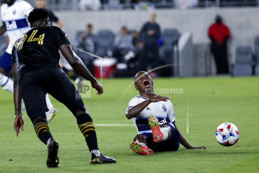 Ringo H.W. Chiu Vancouver Whitecaps midfielder Deiber Caicedo, right, reacts after a foul by Los Angeles FC defender Jesus David Murillo (94) during the second half of an MLS soccer match in Los Angeles, Saturday, July 24, 2021. The game ended in a 2-2 draw. (AP Photo/Ringo H.W. Chiu)