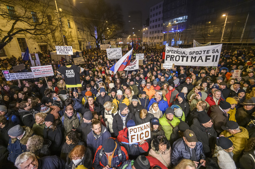 People take part in a protest against a government plan to amend the penal code in Bratislava, on Thursday, Jan. 18, 2024. Slovakia&rsquo;s president has voiced her strong opposition to a plan by the new government of populist Prime Minister Robert Fico to overhaul the country&rsquo;s penal code. The plan approved by Fico's coalition government includes abolishing the special prosecutors&rsquo; office, which handles serious crimes such as graft and organized crime. (Jaroslav Novak/TASR via AP)