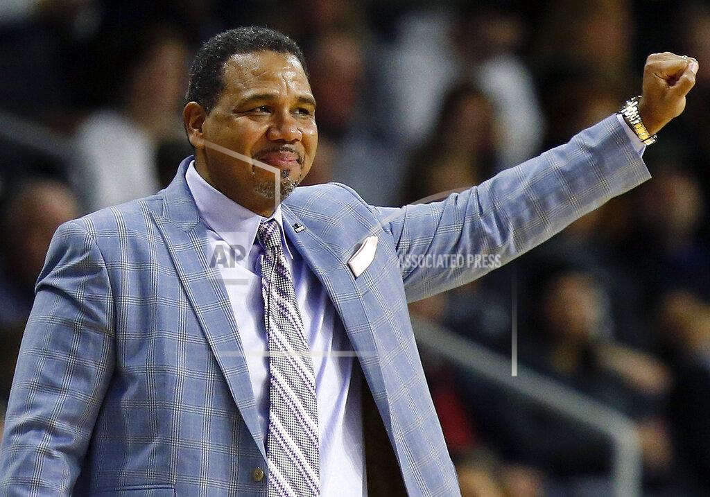 Michael Dwyer FILE - In this Feb. 23, 2019, file photo, Providence head coach Ed Cooley reacts during an NCAA college basketball game against Marquette in Providence, R.I. Providence President Rev. Brian Shanley announced Tuesday, May 21, 2019, that Cooley has agreed to a multiyear contract extension to remain with the Friars and withdrawn his name from consideration for the top job at Michigan. (AP Photo/Michael Dwyer, File)
