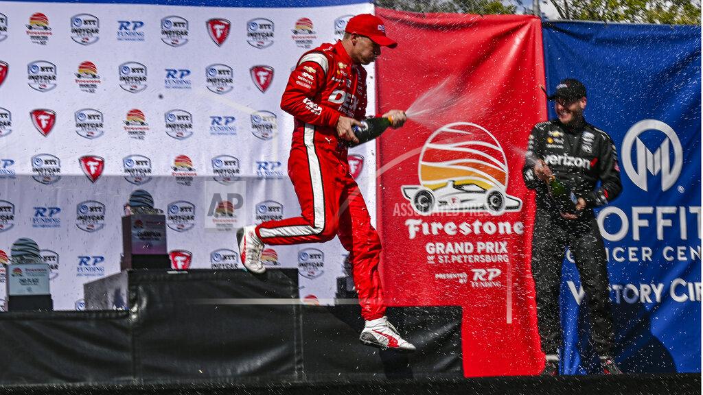 Steve Nesius Team Penske drivers Scott McLaughlin, left, and Will Power celebrate at Victory Lane after McLaughlin won the Grand Prix of St. Petersburg Sunday, Feb.27, 2022, in St. Petersburg, Fla. (AP Photo/Steve Nesius)