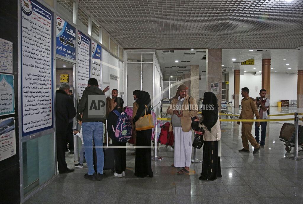 Hani Mohammed Yemenis queue at the departure lounge to board the first commercial flight at Sanaa airport, Yemen, Monday, May 16, 2022. The first commercial flight in six years took off from Yemen’s rebel-held capital on Monday, officials said, part of a fragile truce in the county’s grinding civil war.(AP Photo/Hani Mohammed)