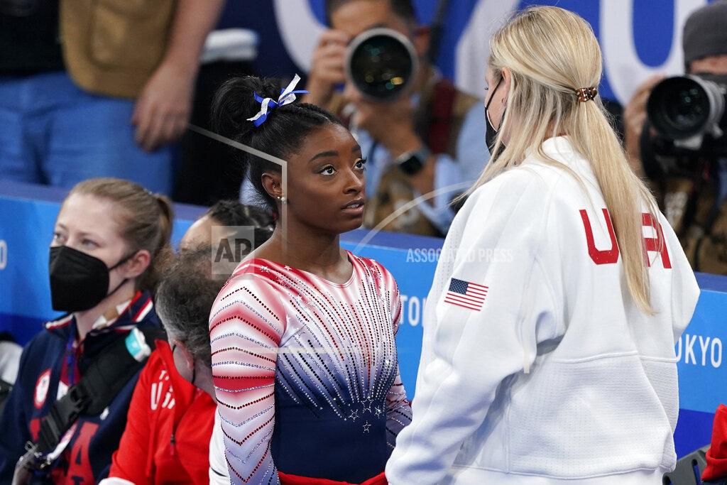 Jae C. Hong Simone Biles, of the United States, speaks with her coach Cecile Landi after performing on the balance beam during the artistic gymnastics women's apparatus final at the 2020 Summer Olympics, Tuesday, Aug. 3, 2021, in Tokyo, Japan. (AP Photo/Jae C. Hong)