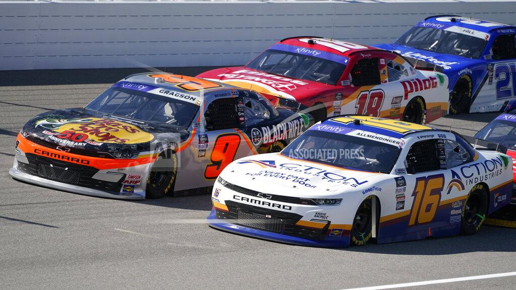 Paul Sancya Noah Gragson (9), AJ Allmendinger (16) and Sammy Smith (18) race during the New Holland 250 NASCAR Xfinity Series auto race at the Michigan International Speedway in Brooklyn, Mich., Saturday, Aug. 6, 2022. (AP Photo/Paul Sancya)