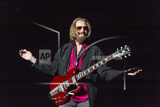 FILE - In a Sunday, Sept. 17, 2017, file photo, Tom Petty and the Heartbreakers perform at KAABOO 2017 at the Del Mar Racetrack and Fairgrounds, in San Diego. Nearly two decades after earning a place in the Rock and Roll Hall of Fame and more than four years after his death, rock icon Petty has been awarded an honorary Ph.D. from the University of Florida, the school’s board of trustees announced Friday, Dec. 3, 2021. (Photo by Amy Harris/Invision/AP, File)