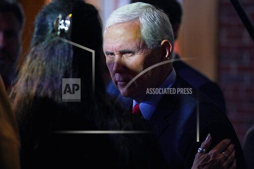 Former Vice President Mike Pence talks with guests during a gathering, Wednesday, Dec. 8, 2021, in Manchester, N.H. (AP Photo/Charles Krupa)