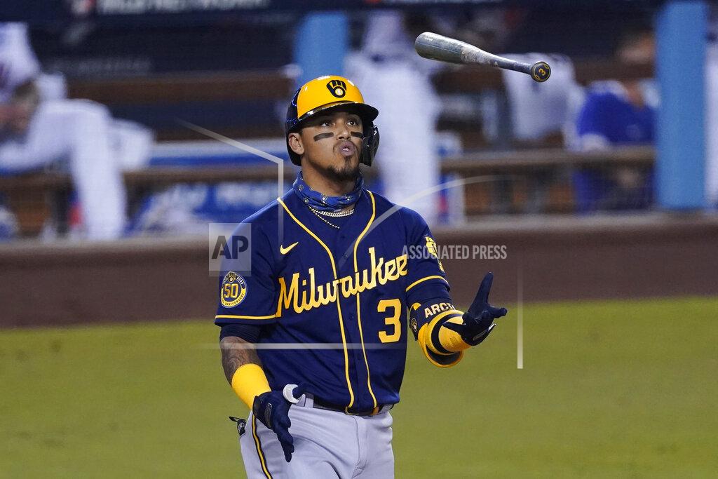 Ashley Landis Milwaukee Brewers' Orlando Arcia flips his bat after striking out during the fourth inning in Game 2 of the team's National League wild-card baseball series against the Los Angeles Dodgers on Thursday, Oct. 1, 2020, in Los Angeles. (AP Photo/Ashley Landis)