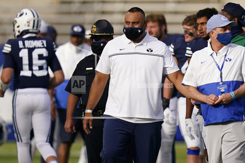 Rick Bowmer BYU head coach Kalani Sitake, center, walks onto the field following an NCAA college football game against UTSA, Saturday, Oct. 10, 2020, in Provo, Utah. (AP Photo/Rick Bowmer, Pool)