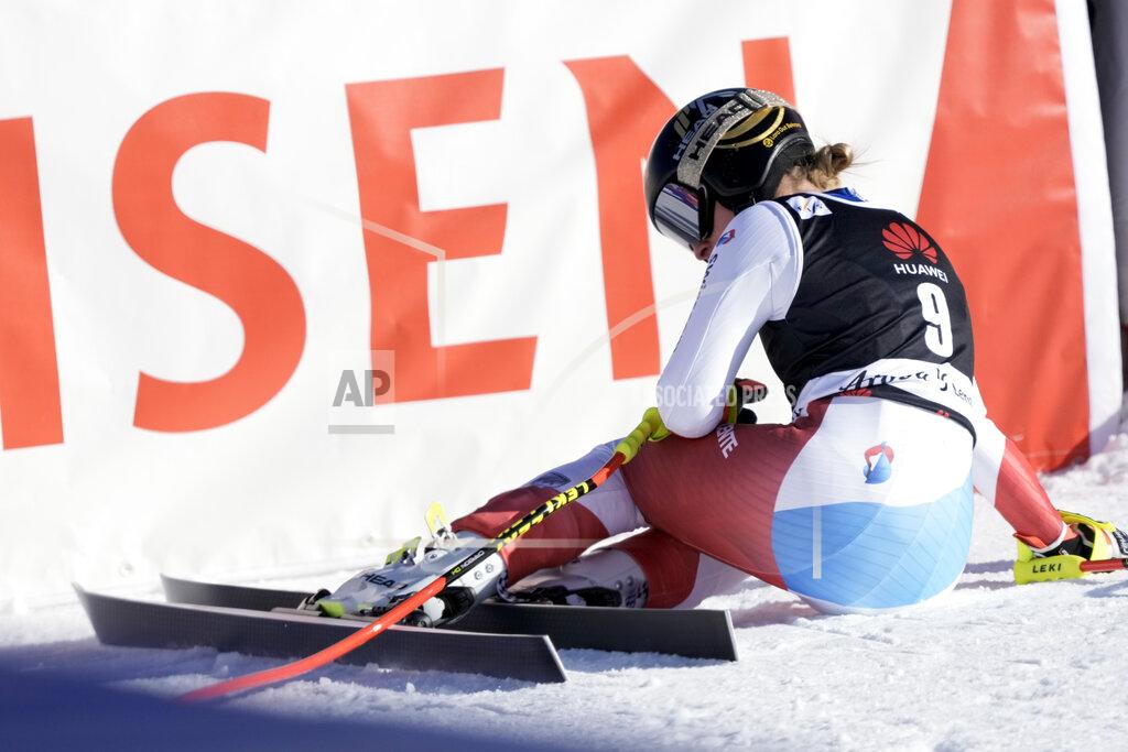 Giovanni Auletta Switzerland's Lara Gut Behrami sits on the snow after crossing the finish line of an alpine ski, women's World Cup super-G, in Lenzerheide, Switzerland, Saturday, March 5, 2022. (AP Photo/Giovanni Auletta)