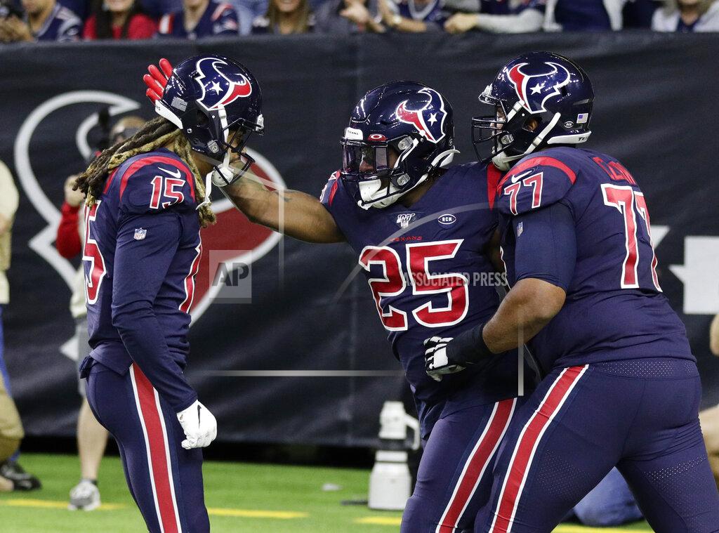 Mike Marshall Houston Texans running back Duke Johnson (25) celebrates his touchdown against the New England Patriots with teammates during the first half of an NFL football game Sunday, Dec. 1, 2019, in Houston. (AP Photo/Mike Marshall)