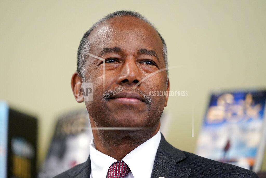 FILE - In this Sept. 22, 2020, file photo Housing and Urban Development Secretary Ben Carson speaks to reporters after touring the Plymouth Place senior housing facility in Des Moines, Iowa. Carson is crediting unapproved, experimental treatments with saving his life after saying he became “desperately ill” following his infection with the coronavirus. There is no medical evidence that the treatments Carson cites in a statement on his personal Facebook page worked. (AP Photo/Charlie Neibergall, File)