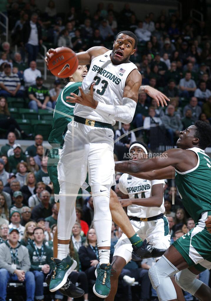 Al Goldis Michigan State's Xavier Tillman (23) pulls down a rebound against Eastern Michigan's Boubacar Toure, right, during the first half of an NCAA college basketball game, Saturday, Dec. 21, 2019, in East Lansing, Mich. (AP Photo/Al Goldis)