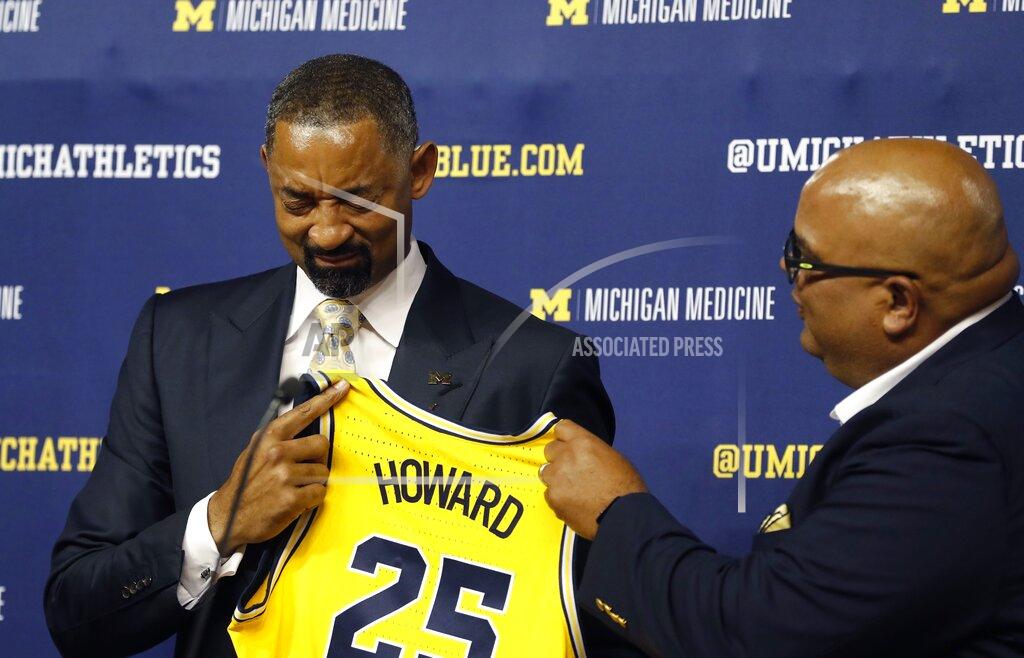 Carlos Osorio Juwan Howard reacts with tears of joys as he is introduced as Michigan's new men's NCAA college basketball coach by Director of Athletics Warde Manuel, Thursday, May 30, 2019 in Ann Arbor, Mich. The former member of the Fab Five has a five-year contract that will pay him $2 million in his first year. The former Miami Heat assistant coach replaces John Beilein, who left to coach the Cleveland Cavaliers. (AP Photo/Carlos Osorio)