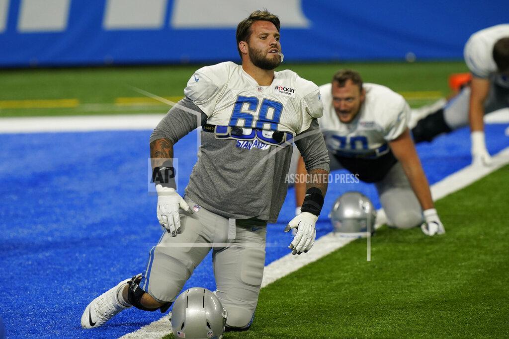 Detroit Lions offensive tackle Taylor Decker (68) finishes stretching before drills at the Lions NFL football practice, Wednesday, Sept. 2, 2020, in Detroit. (AP Photo/Carlos Osorio)