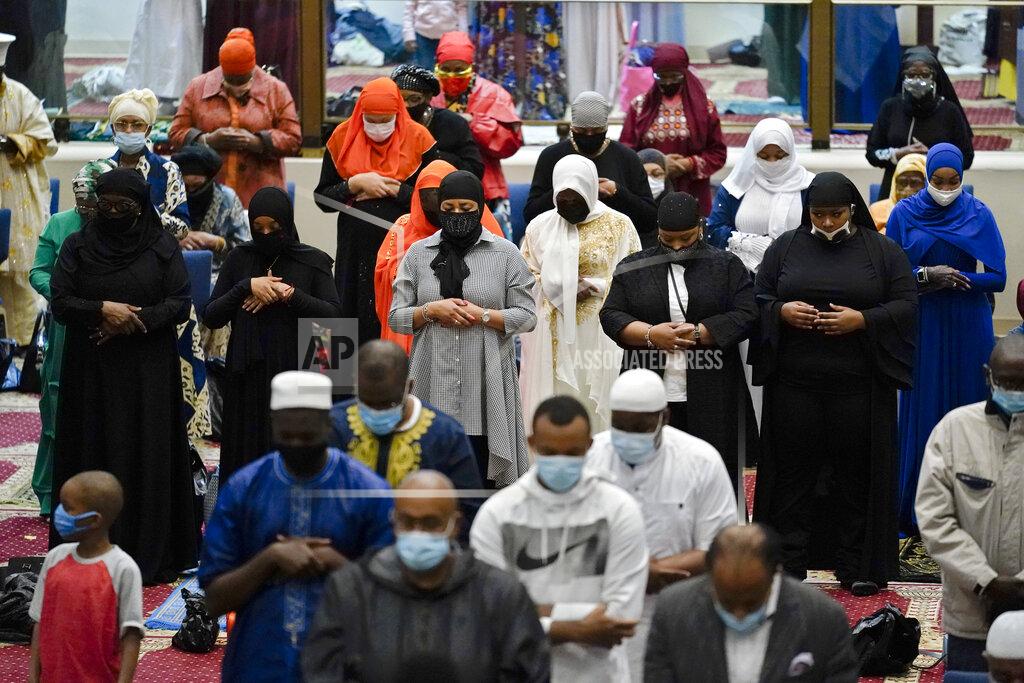 Matt Rourke Worshippers perform an Eid al-Fitr prayer at the Masjidullah Mosque in Philadelphia, Thursday, May 13, 2021. Millions of Muslims across the world are marking a muted and gloomy holiday of Eid al-Fitr, the end of the fasting month of Ramadan - a usually joyous three-day celebration that has been significantly toned down as coronavirus cases soar. (AP Photo/Matt Rourke)