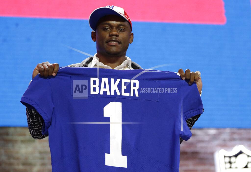 Mark Humphrey Georgia defensive back DeAndre Baker poses with his new jersey after the New York Giants selected Baker in the first round at the NFL football draft, Thursday, April 25, 2019, in Nashville, Tenn. (AP Photo/Mark Humphrey)
