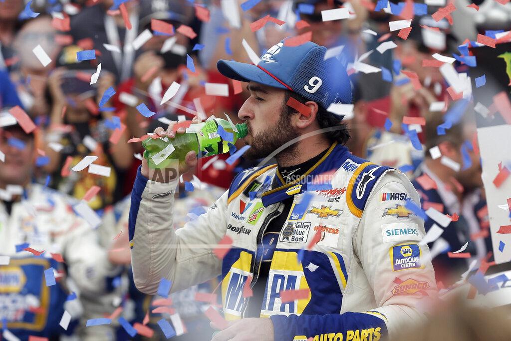 Gerry Broome Chase Elliott has a drink in victory lan after winning the NASCAR Cup Series auto race at Charlotte Motor Speedway in Concord, N.C., Sunday, Sept. 29, 2019. (AP Photo/Gerry Broome)