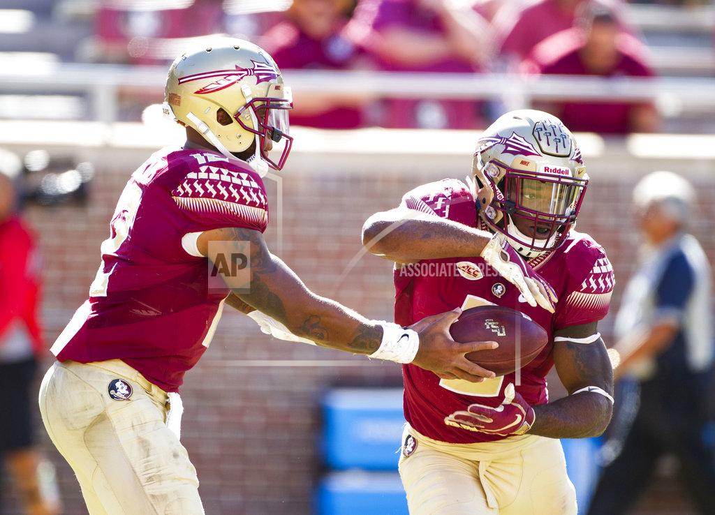 Mark Wallheiser Florida State quarterback Deondre Francois hands the ball off to running back Cam Akers in the second half of an NCAA college football game in Tallahassee, Fla., Saturday, Oct.27, 2018. Clemson defeated Florida State 59-10. (AP Photo/Mark Wallheiser)