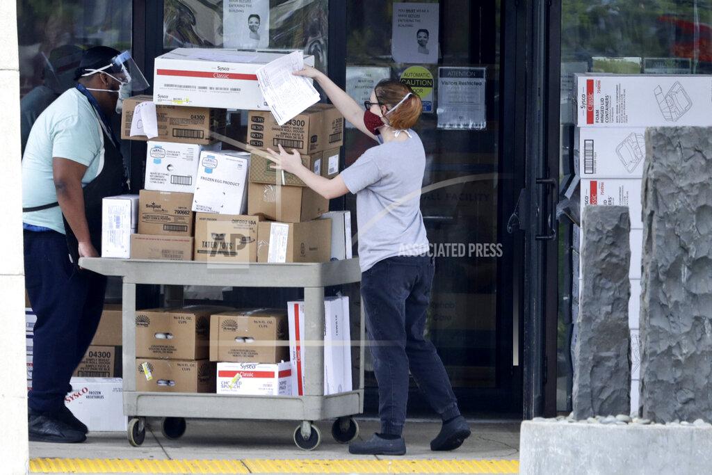 Tony Dejak Workers push a cart of supplies into Greenbrier Health Center, Tuesday, May 19, 2020, in Parma Heights, Ohio. The number of deaths from the coronavirus in Ohio's nursing homes is now over 1,000. That means long-term centers account for three out of five deaths from the virus in the state. Greenbrier has at least 24 cumulative resident cases and 12 cumulative staff cases. (AP Photo/Tony Dejak)