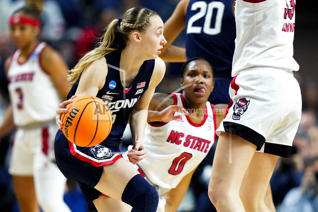 Frank Franklin Ii Connecticut guard Paige Bueckers (5) handles the ball against NC State during the fourth quarter of the East Regional final college basketball game of the NCAA women's tournament, Monday, March 28, 2022, in Bridgeport, Conn. (AP Photo/Frank Franklin II)