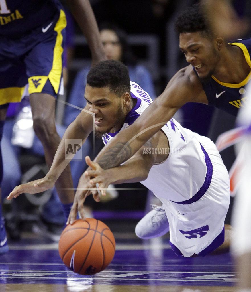 Orlin Wagner Kansas State forward Levi Stockard III (34) dives for the ball against West Virginia forward Derek Culver, right, during the first half of an NCAA college basketball game in Manhattan, Kan., Wednesday, Jan. 9, 2019. (AP Photo/Orlin Wagner)