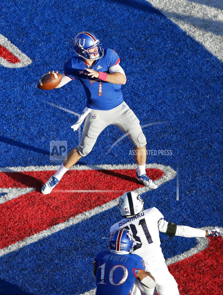 Orlin Wagner Kansas quarterback Peyton Bender (7) prepares to throw the ball out the back of the end zone for a safety late in the second half of an NCAA college football game against TCU in Lawrence, Kan., Saturday, Oct. 27, 2018. (AP Photo/Orlin Wagner)