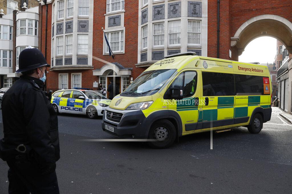 Frank Augstein Police officers stand at an entrance to the King Edward VII Hospital where Prince Philip is being treated for an infection, as an ambulance is driven out, in London, Monday, March 1, 2021. (AP Photo/Frank Augstein)