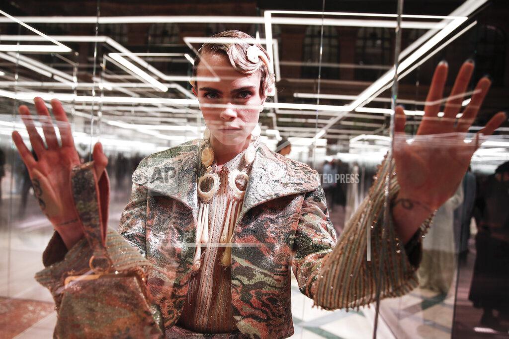 Francois Mori FILE - In this Jan. 27, 2021 file photo, model Cara Delevingne wears a creation for Fendi's Spring-Summer 2021 Haute Couture fashion collection presented in Paris. The pandemic has torn a multibillion-dollar bite out of the fabric of Europe's luxury industry, stopped runway shows and forced brands to show their designs digitally instead. Now, amid hopes of a return to near-normality by the year’s end, the industry is asking what fashion will look like as it dusts itself and struggles to its well-heeled feet again. (AP Photo/Francois Mori, File)