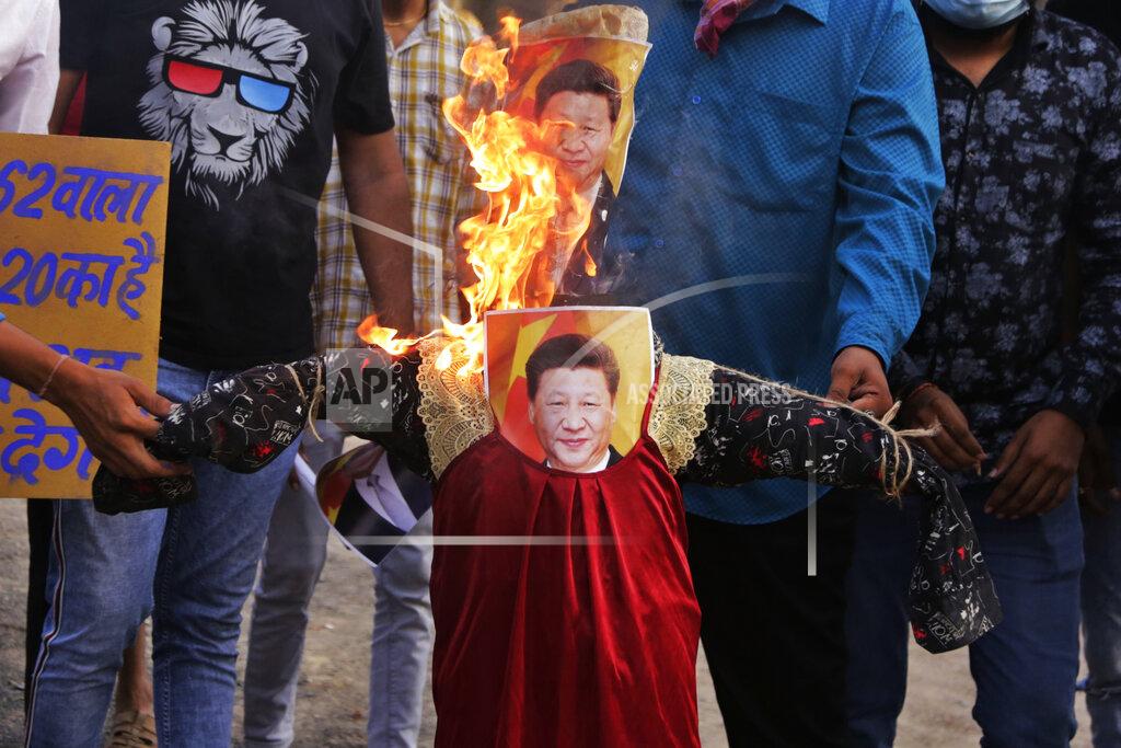 Ajit Solanki FILE- In this June 18, 2020 file photo,Indians protesting against the killing of twenty Indian troops with Chinese soldiers in the Galwan Valley, burn an effigy of Chinese President Xi Jinping in Ahmedabad, India. As Americans celebrate or fume over the new U.S. president-elect, many in Asia are waking up to the reality of a Joe Biden administration with decidedly mixed feelings. According to Michael Kugelman, deputy director of the Asia Program at the Washington-based Wilson Center, India and the United States will work more closely to counterbalance China, a shared rival. (AP Photo/Ajit Solanki, File)