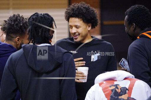 Sue Ogrocki Cade Cunningham, center, talks with his teammates after announcing that he will enter the NBA draft after a dynamic freshman season that saw him named a first-team AP All-American, Thursday, April 1, 2021, in Stillwater, Okla. (AP Photo/Sue Ogrocki)