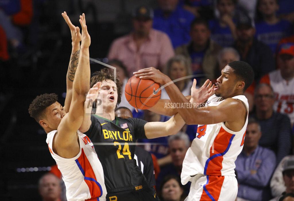 Matt Stamey Florida forward Kerry Blackshear Jr. (24) steals the ball from Baylor guard Matthew Mayer (24) as he is defended by Florida forward Keyontae Johnson (11) during the first half of an NCAA college basketball game Saturday, Jan. 25, 2020, in Gainesville, Fla. (AP Photo/Matt Stamey)