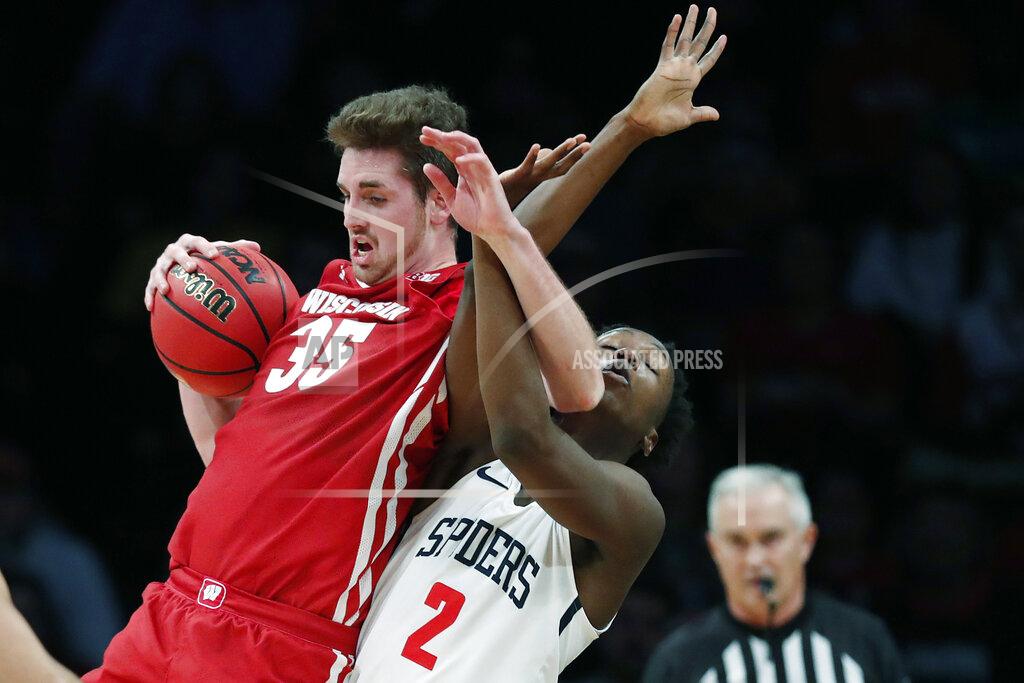 Kathy Willens Wisconsin forward Nate Reuvers (35) gets tangled up with Richmond forward Souleymane Koureissi (2) during the second half of an NCAA college basketball game in the Legends Classic, Monday, Nov. 25, 2019, in New York. Richmond defeated Wisconsin 62-52. (AP Photo/Kathy Willens)
